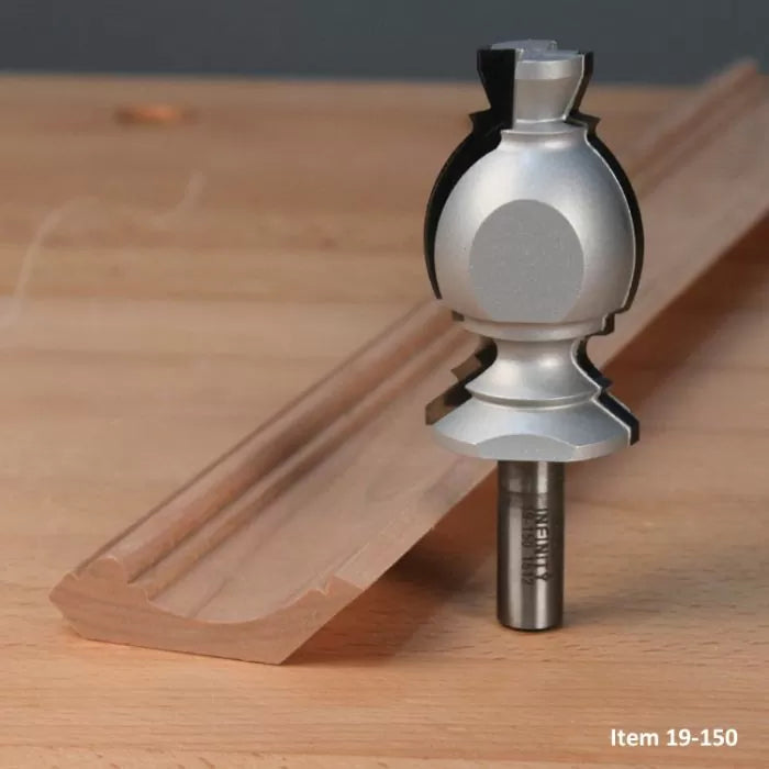 Woodworking router bit with decorative edge molding profile on a wooden surface