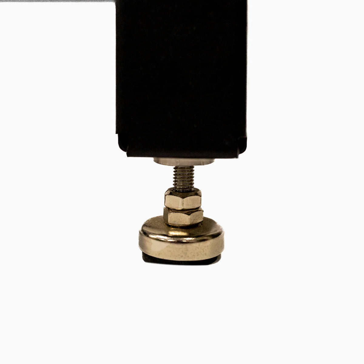 Adjustable metal leveling foot for woodworking table or workbench