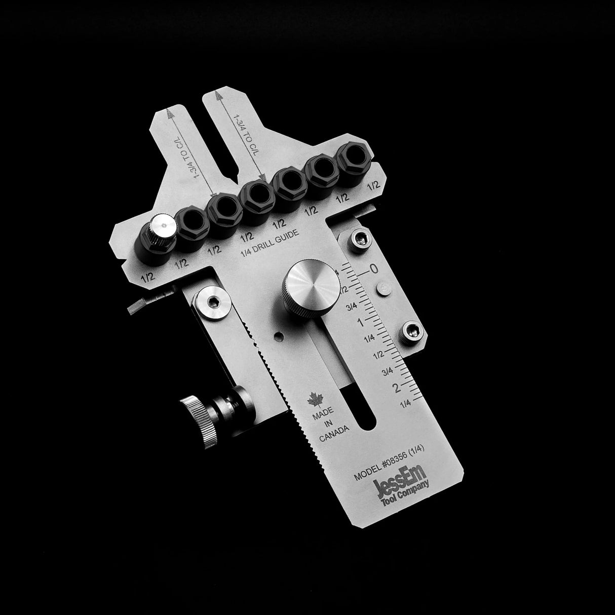 Adjustable metal dowel drilling jig with guide bushings and measurement markings