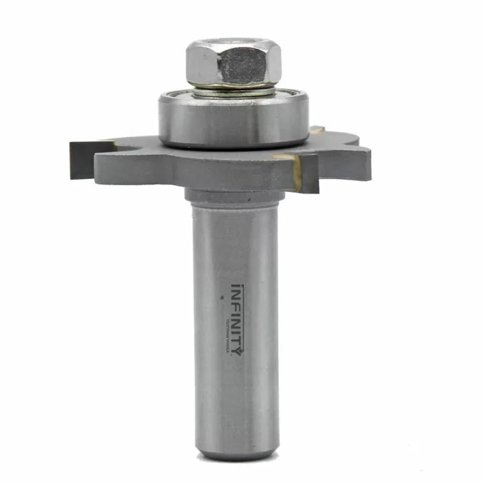 Carbide woodworking slot cutting router bit with bearing and hex nut, isolated on white background.