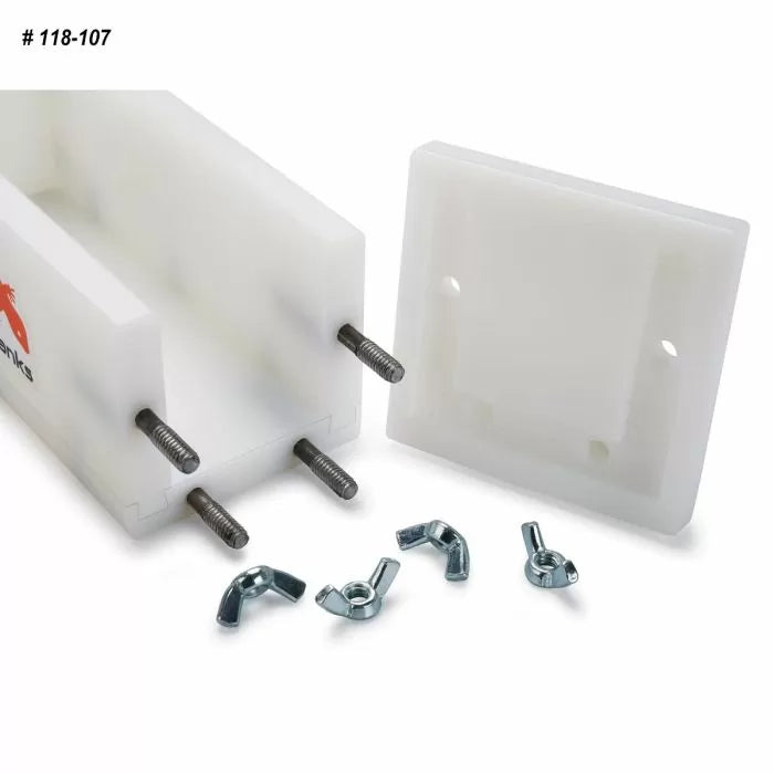 Woodworking joinery jig with bolts, wing nuts, and removable faceplate for precise assembly.