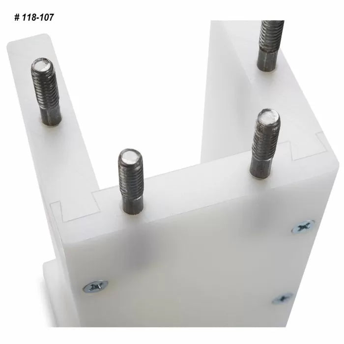 Close-up of woodworking joinery jig with four metal guide pins and white plastic body
