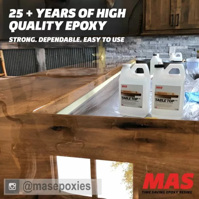 Glossy wood table with MAS Table Top epoxy resin containers in a workshop setting