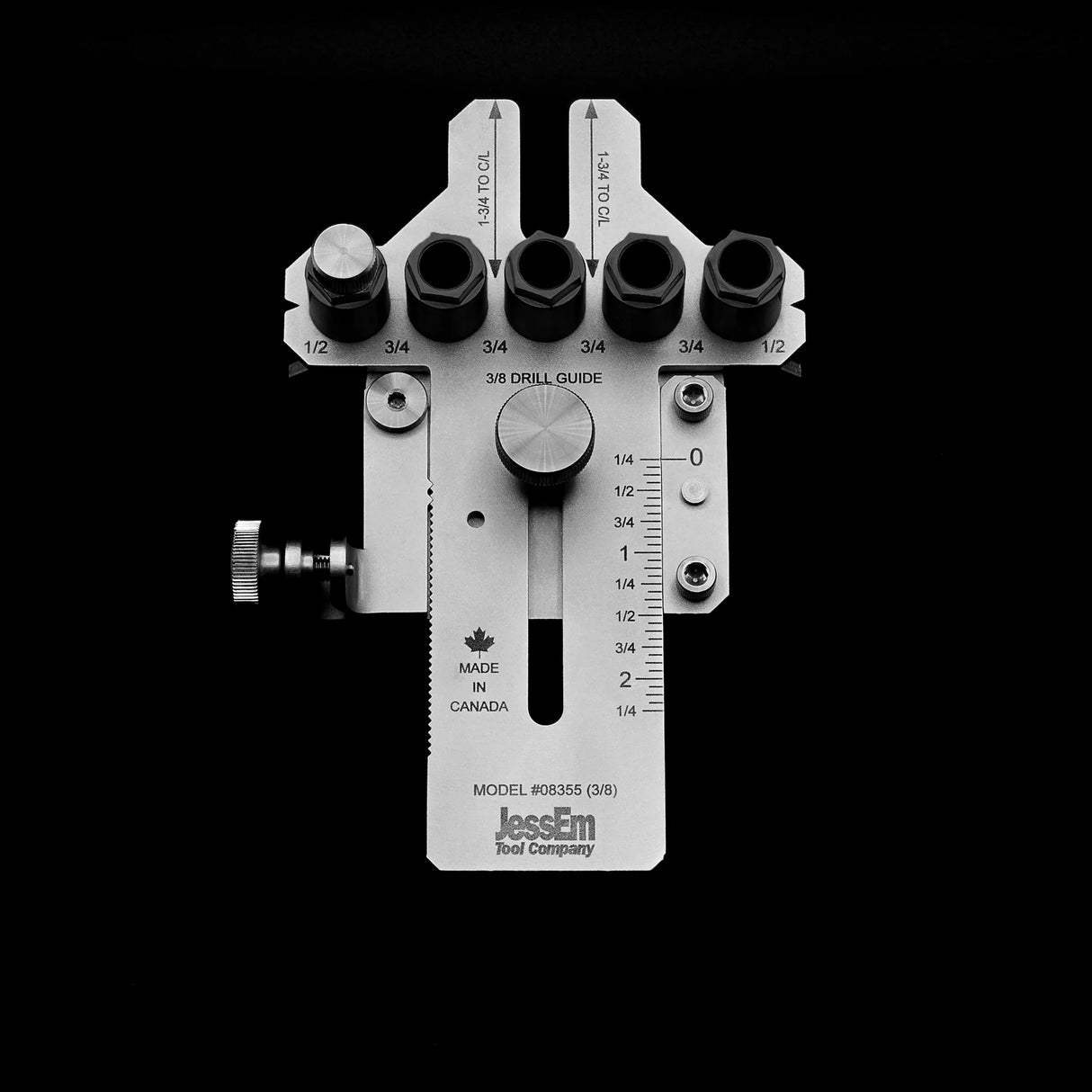 Metal woodworking drill guide jig with adjustable bushings and measurement markings on a black background