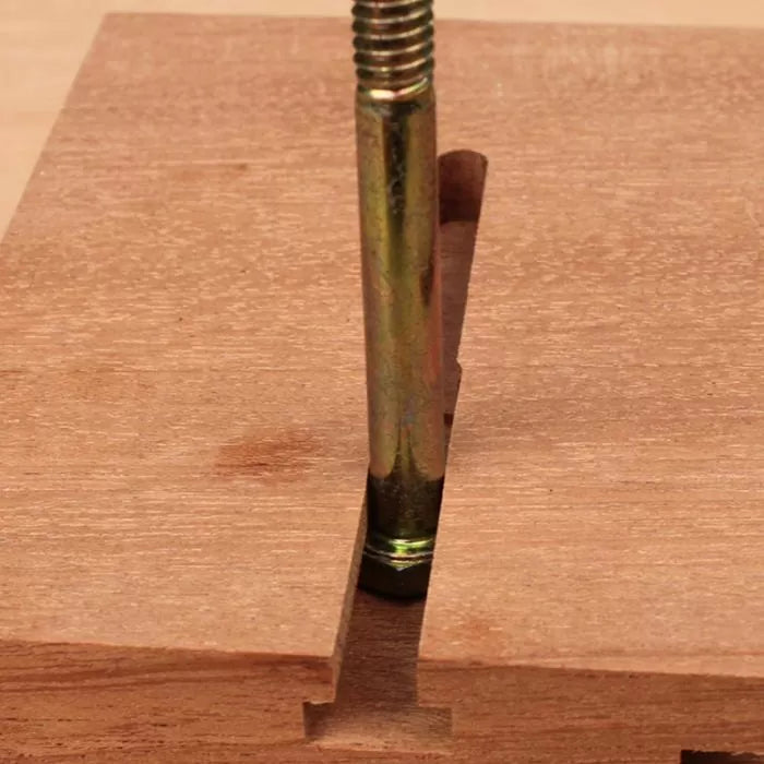 Threaded metal bolt in T-slot track on wooden woodworking jig
