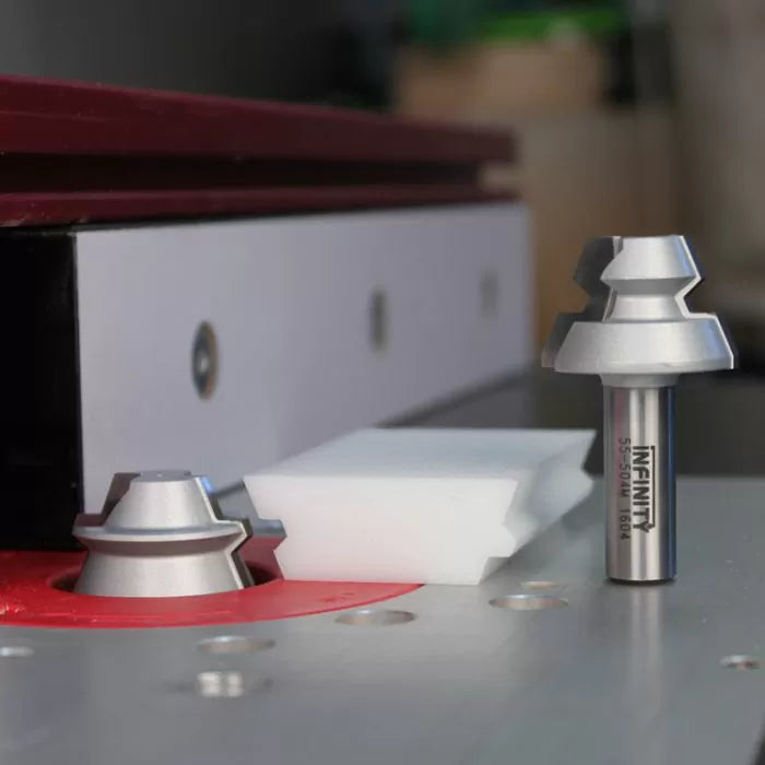 Router table with lock miter router bit and cut sample for woodworking joints