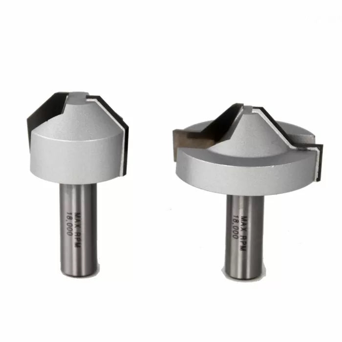 Two carbide-tipped router bits for woodworking, isolated on a white background.