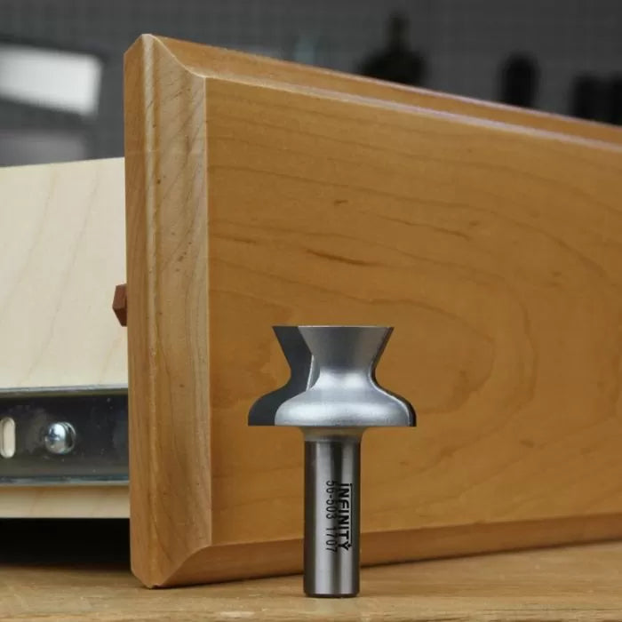 Drawer lock router bit for woodworking, shown beside a wooden drawer front