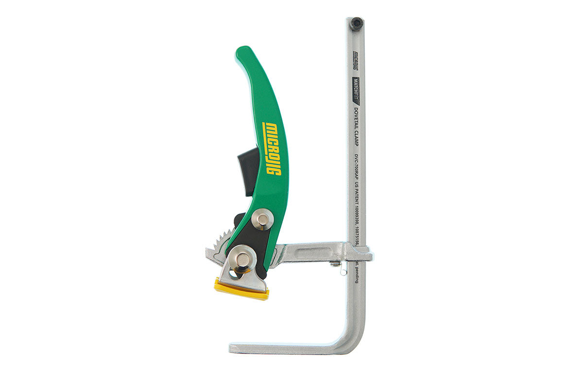 Microjig dovetail ratchet clamp for woodworking, green handle, isolated on white background