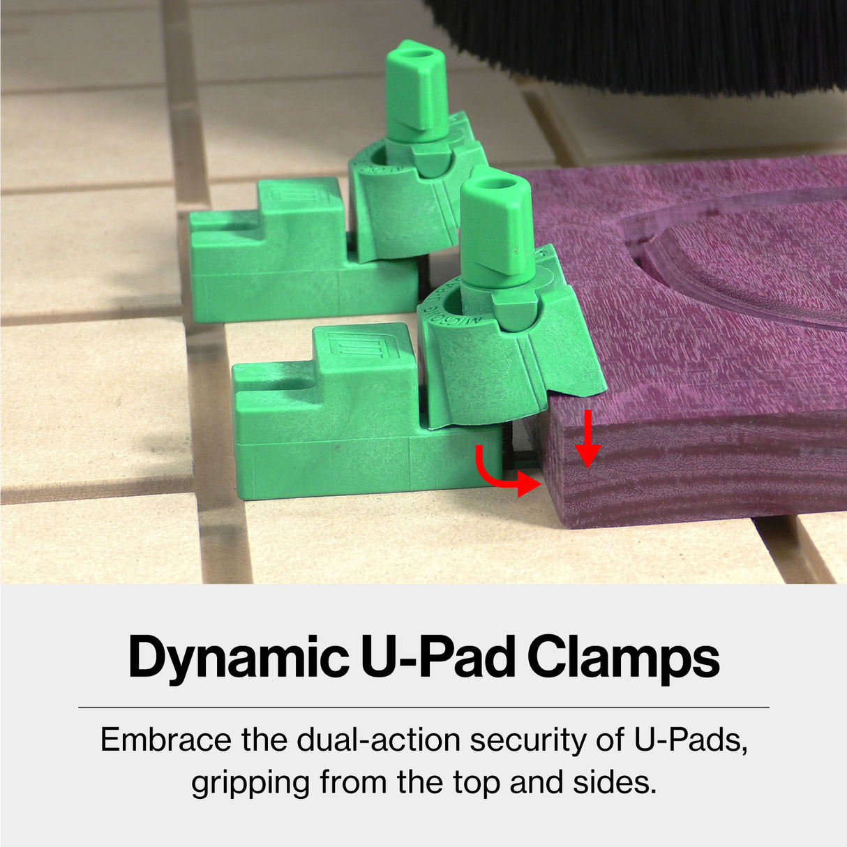 Green CNC U-Pad clamps securing a purple wood board on a workbench for woodworking.