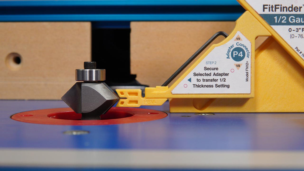 Router table with a carbide router bit and depth gauge tool for woodworking precision