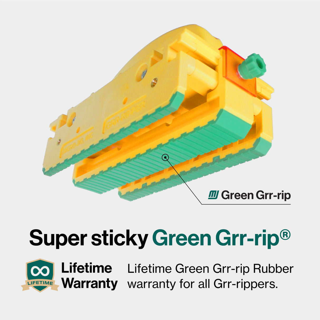 Yellow woodworking push block with green Grr-rip rubber grip and lifetime warranty text.