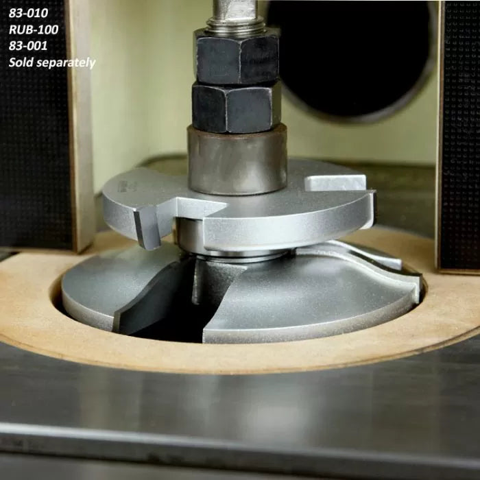 Close-up of a shaper cutter head installed on a woodworking router table