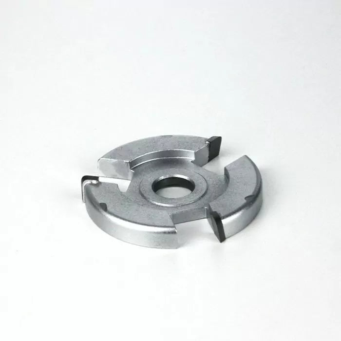 Carbide-tipped woodworking slot cutter blade on a white background