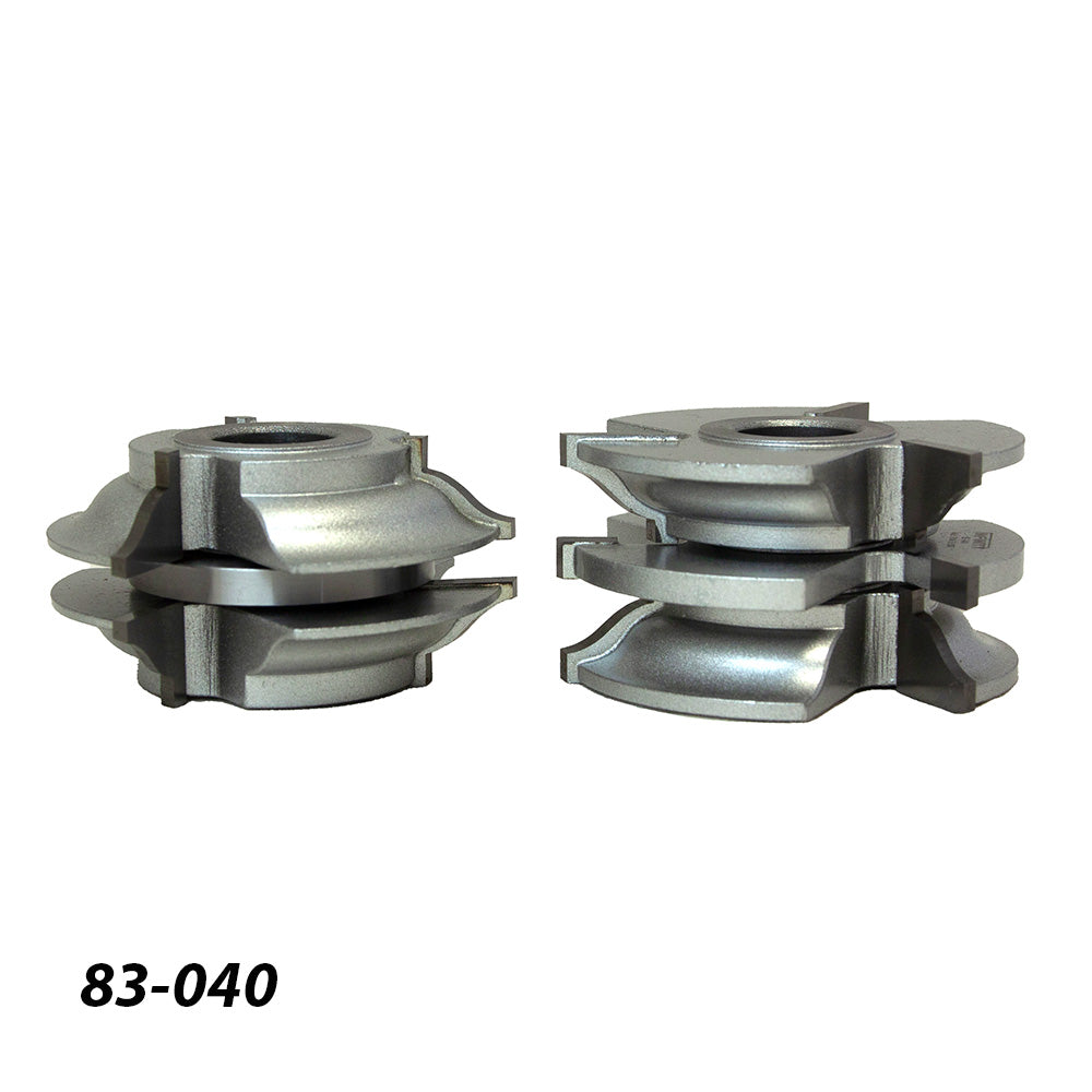 Set of two metal woodworking router bit cutters with stacked profiles on white background