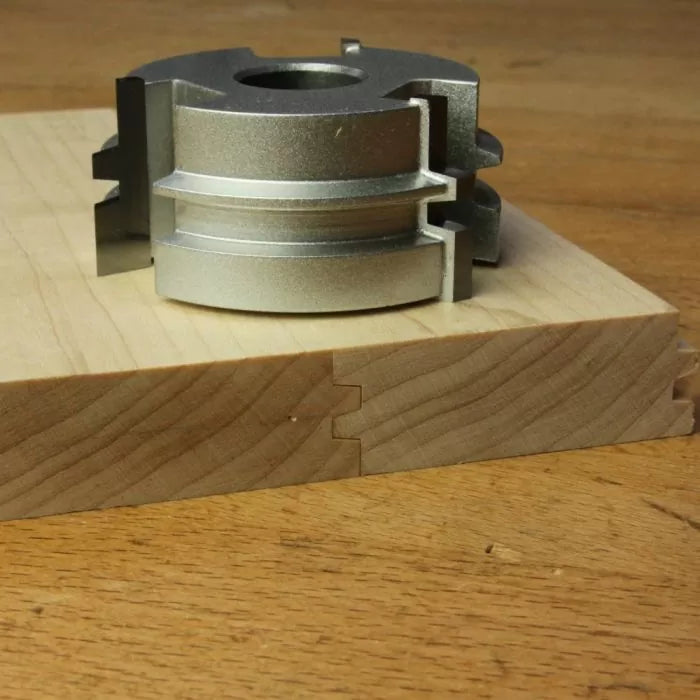 Display cutter head with tongue and groove finished profile on hardwood, woodworking tool closeup