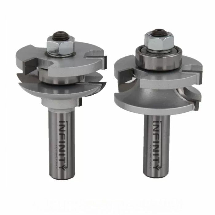 Two steel router bits with bearings for woodworking joinery on white background
