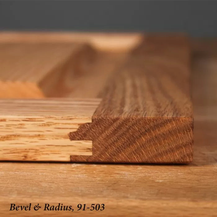 Close-up of beveled and radius edge wood joint, ideal for woodworking projects.