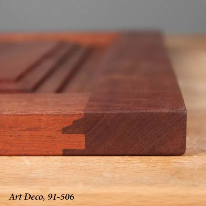 Close-up of a wooden board with dovetail joint and decorative groove, woodworking detail