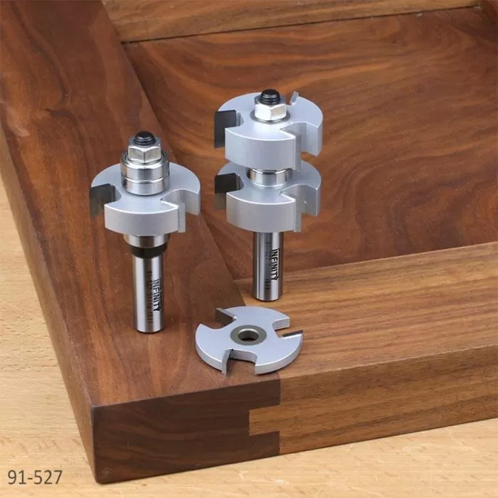 Router bit set for woodworking joinery displayed on a dovetail corner joint