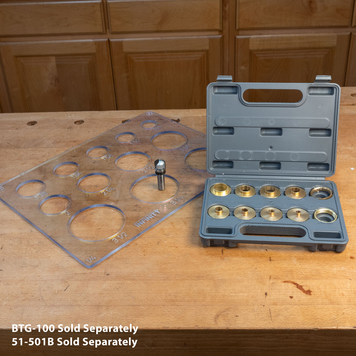 Router template guide set with brass bushings, clear template, and bit on woodworking bench