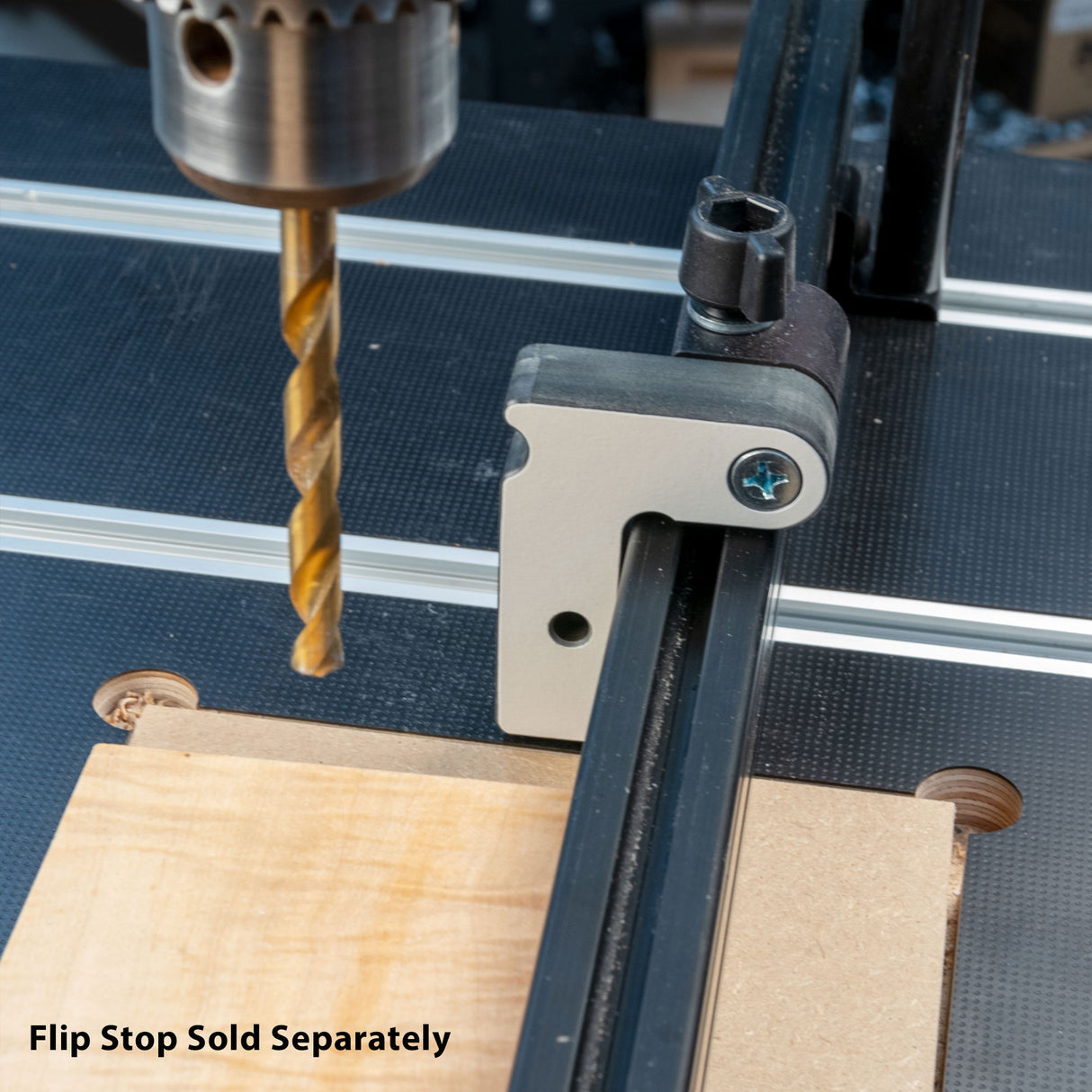 Drill press with flip stop fence for woodworking, flip stop accessory sold separately.
