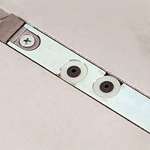 Table saw miter slot with adjustable metal insert, close-up woodworking tool component