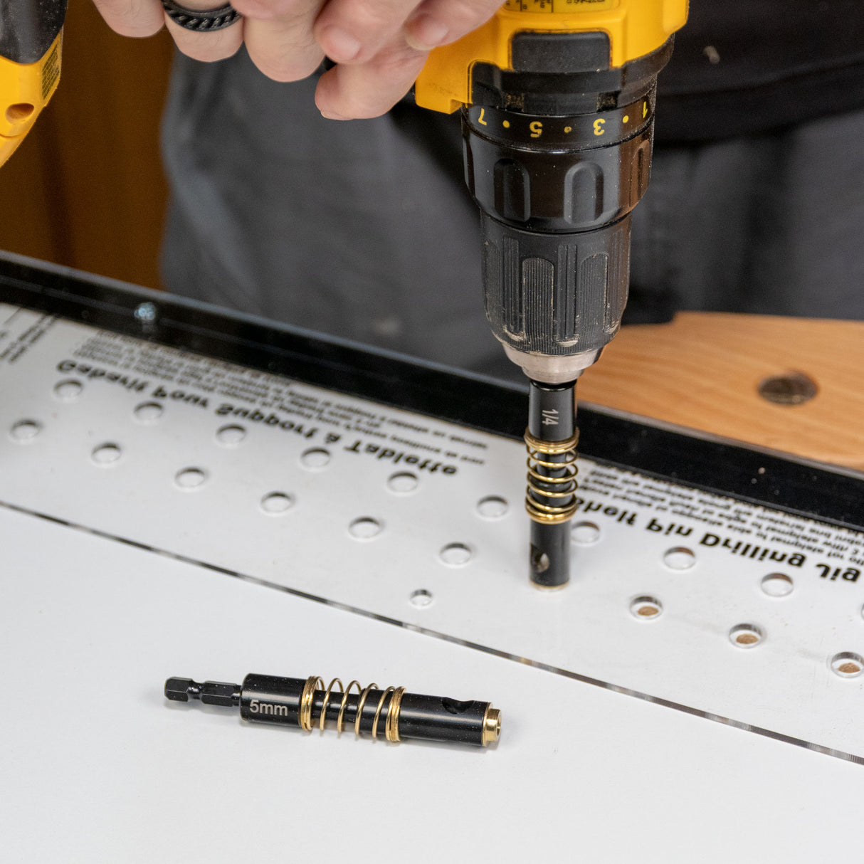 Shelf pin jig used with a drill for precise woodworking hole placement