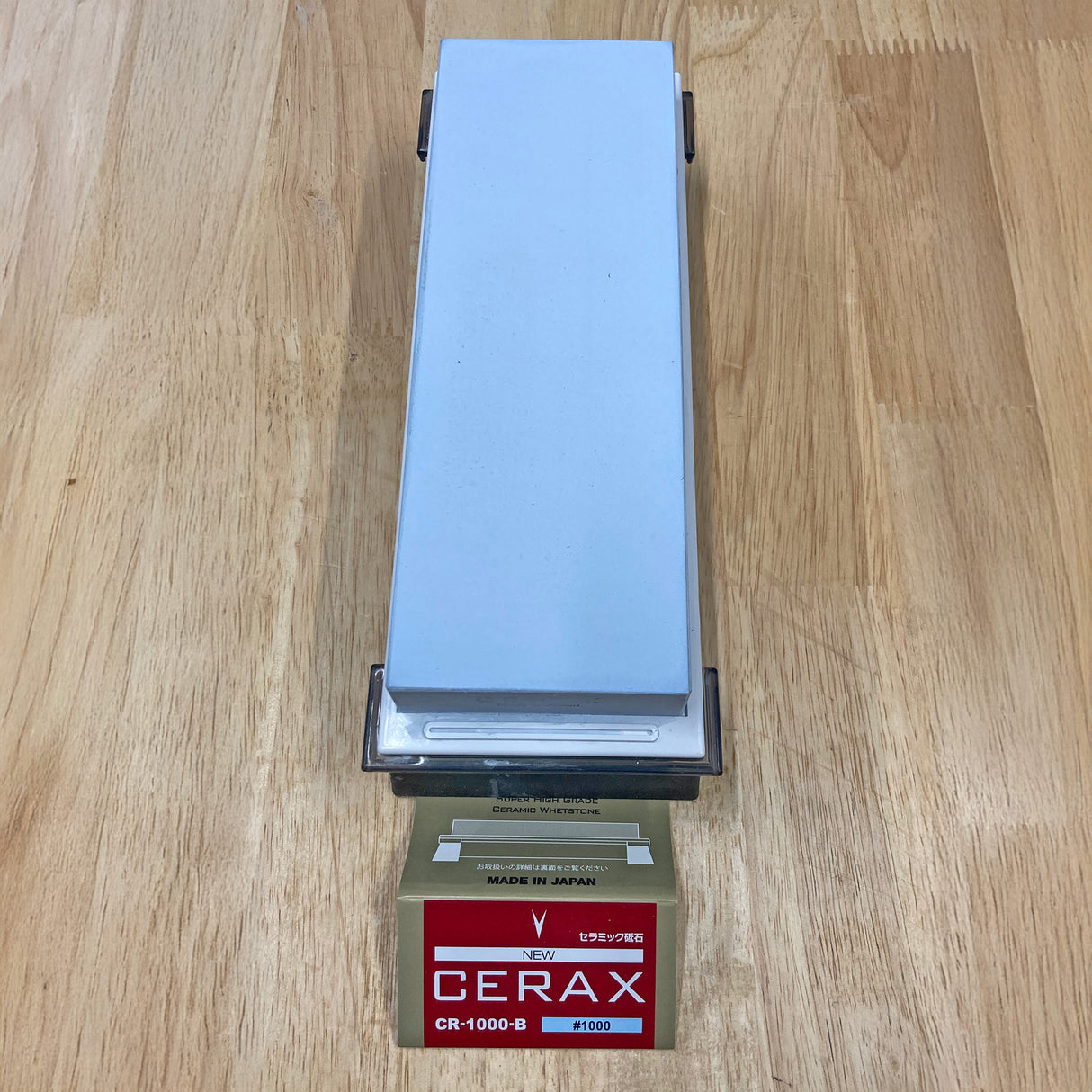 Cerax 1000 ceramic sharpening whetstone on wooden surface, ideal for woodworking tools.