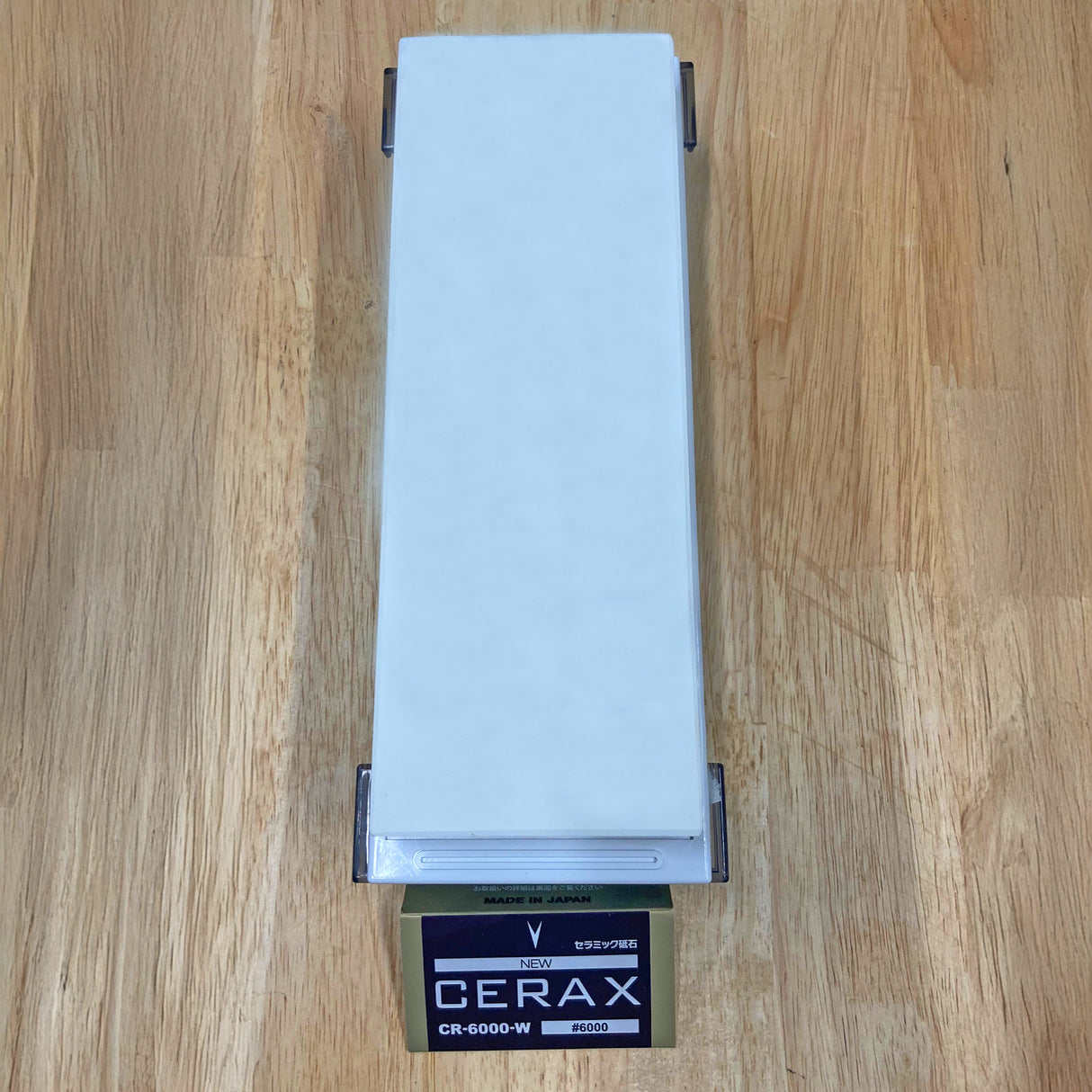 Cerax 6000 grit sharpening stone on wood surface, ideal for fine tool honing