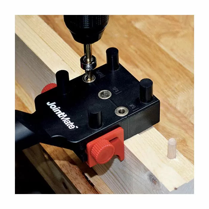 Doweling jig tool clamped on wood for precise joinery, drill bit creating dowel holes