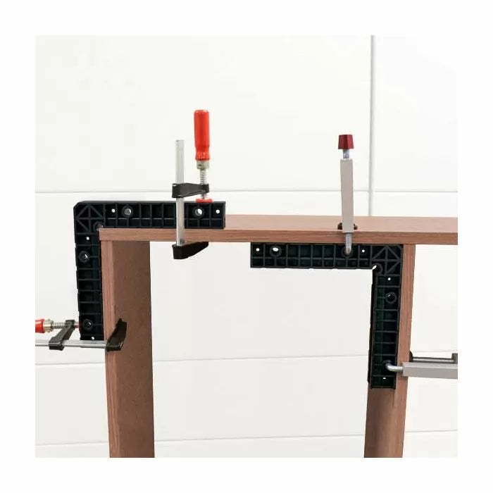 Woodworking corner clamp set holding two boards at 90 degrees for precise assembly