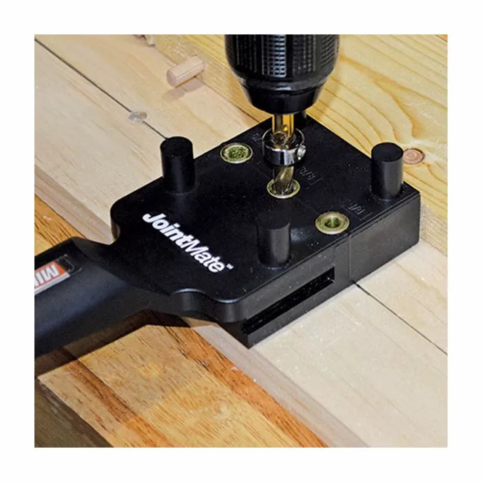 Woodworking dowel jig with drill guide clamped on wood, drilling pocket holes