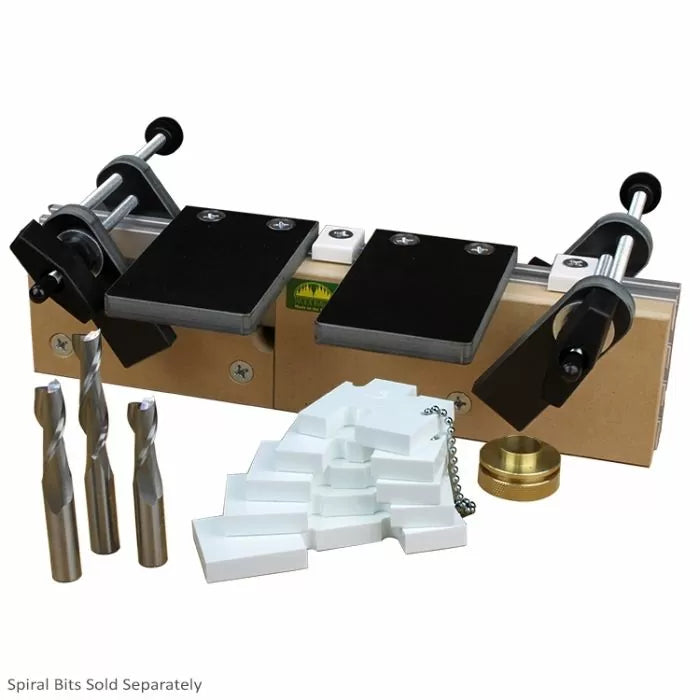 Woodworking joinery jig with clamps, spiral router bits, and setup accessories