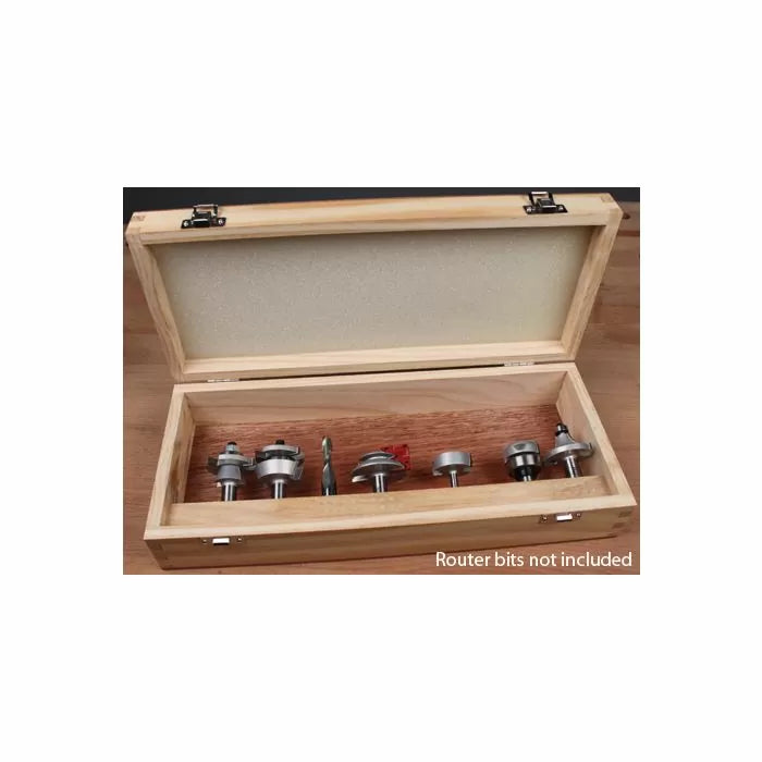 Empty wooden storage box for router bits displayed open on a workbench
