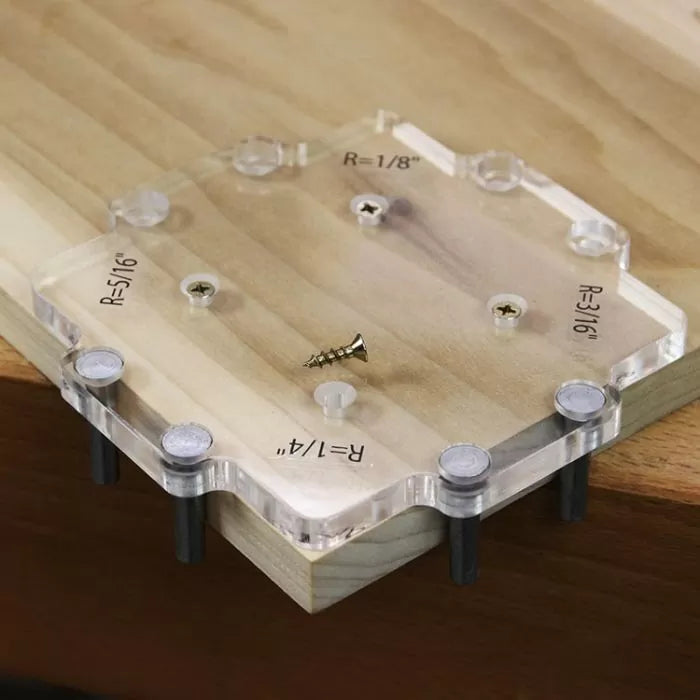 Acrylic woodworking corner radius jig on wood board with screws, for precise router cuts