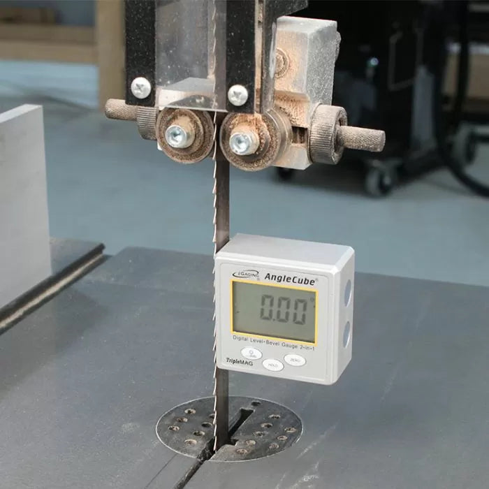 Digital angle gauge measuring bandsaw blade alignment on woodworking bandsaw table