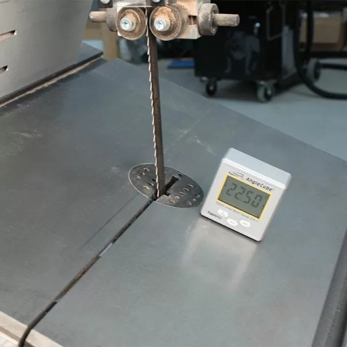 Bandsaw table with precision digital angle gauge measuring blade tilt