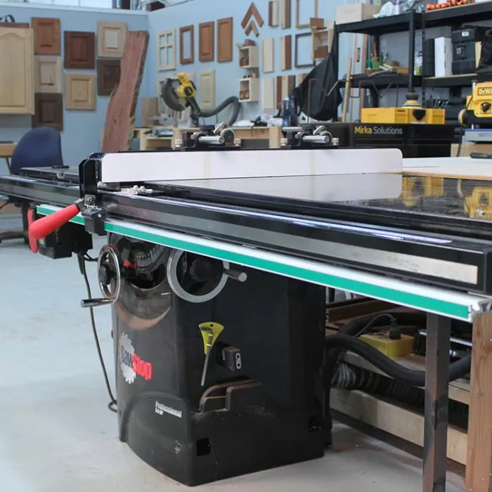 Table saw workstation with fence and accessories in a woodworking shop