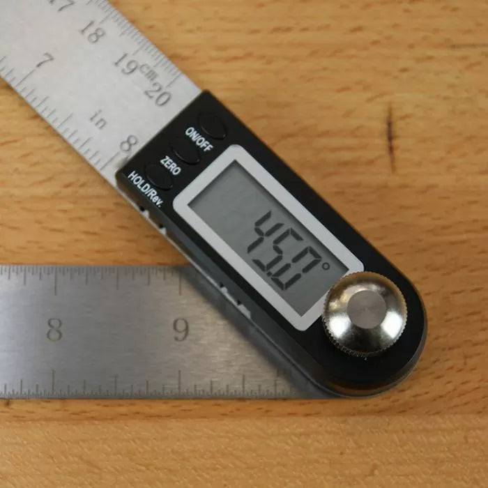 Digital angle gauge measuring 45 degrees on stainless steel ruler, woodworking tool close-up