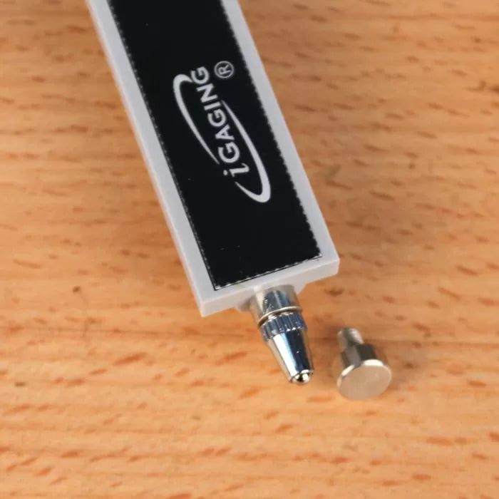 iGaging digital caliper probe tip and metal accessory on wood surface