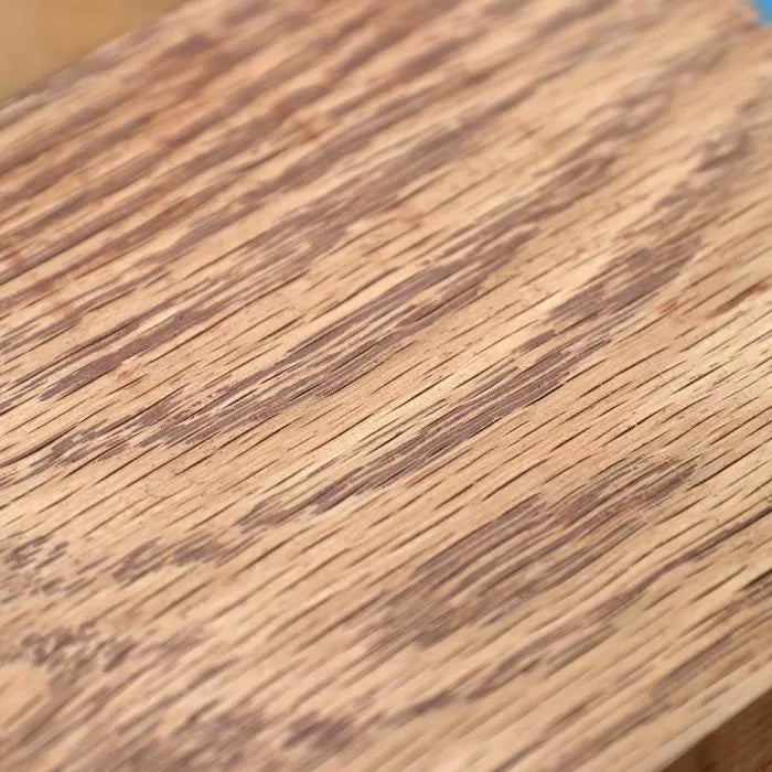 Close-up of wood grain on a filled hardwood surface for woodworking repair