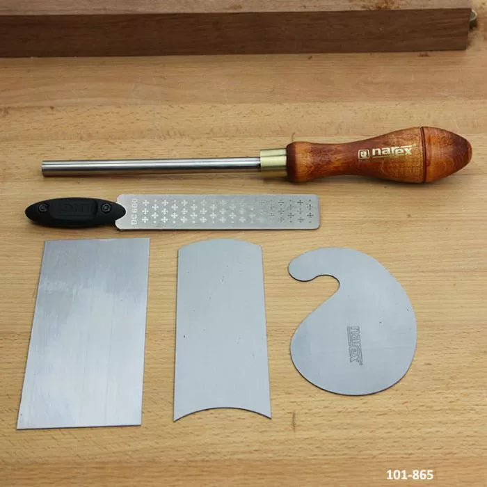 Woodworking scraper tool set with wooden handle, metal burnisher, and three steel scrapers on a workbench.