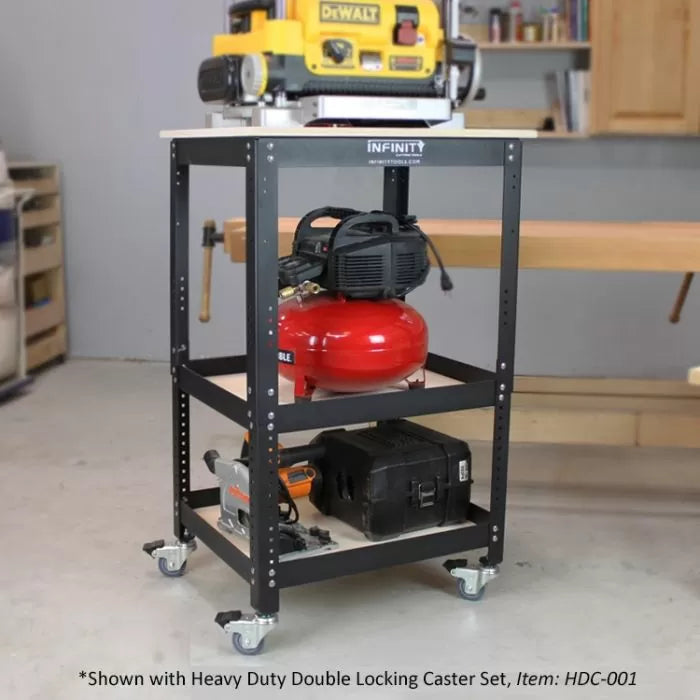 Heavy-duty mobile tool cart with power tools and air compressor on metal shelves in a workshop