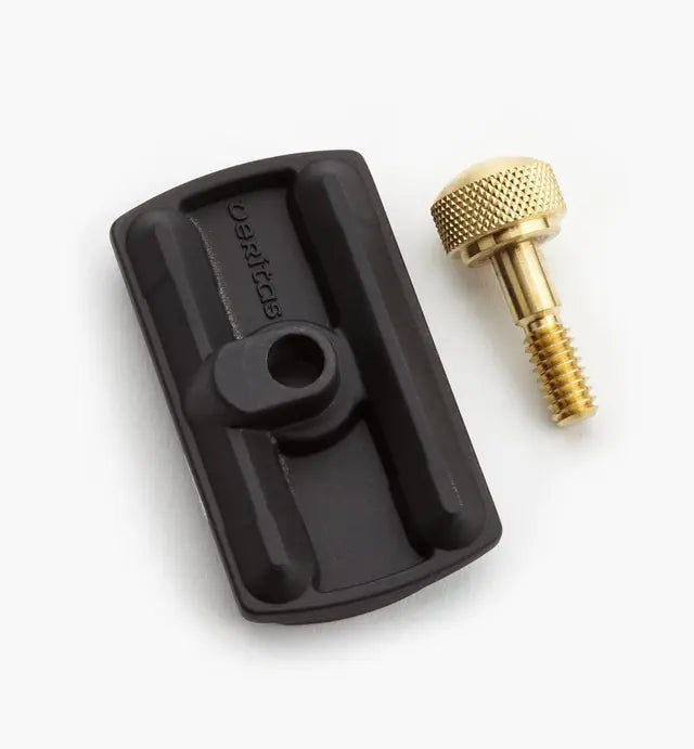 Black woodworking jig accessory part with brass knurled screw for router table setup
