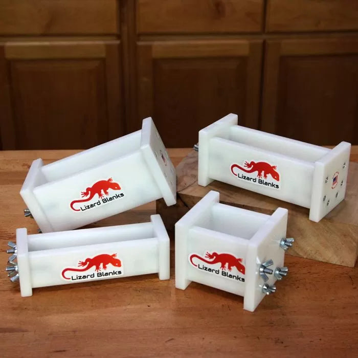Set of white woodworking resin casting molds labeled Lizard Blanks on a workbench