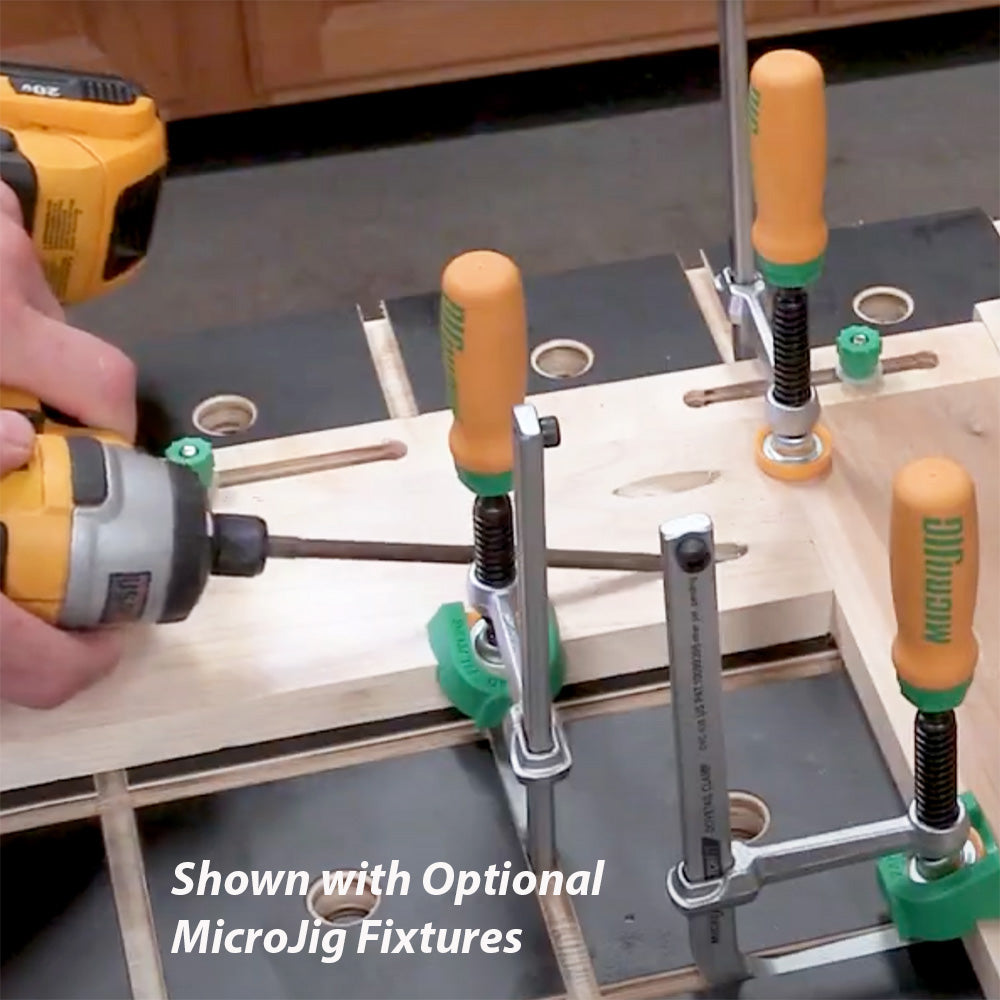 Person using power drill with wood clamps and MicroJig fixtures on a woodworking table