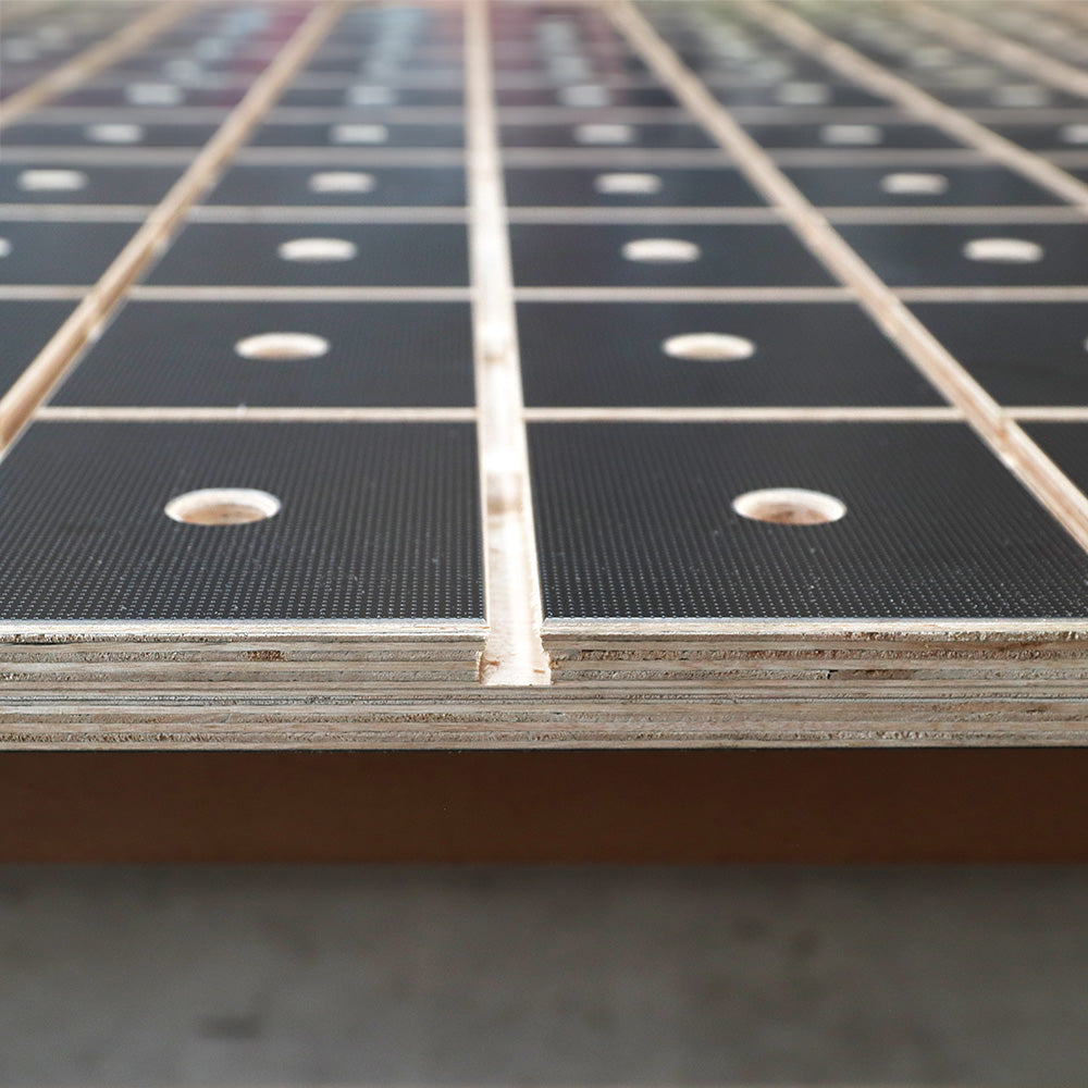 MFT workbench top with grid pattern, dog holes, and textured black surface for woodworking