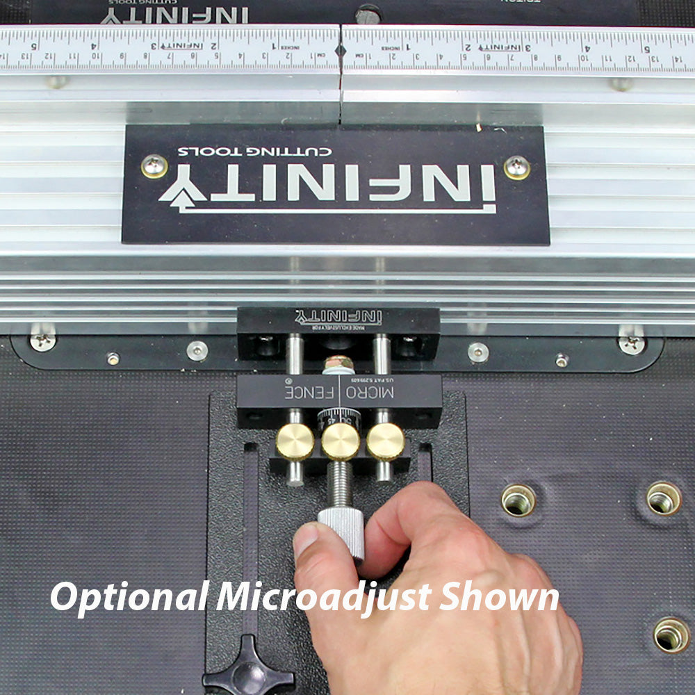 Hand adjusting micro fence attachment on woodworking router table for precise cuts