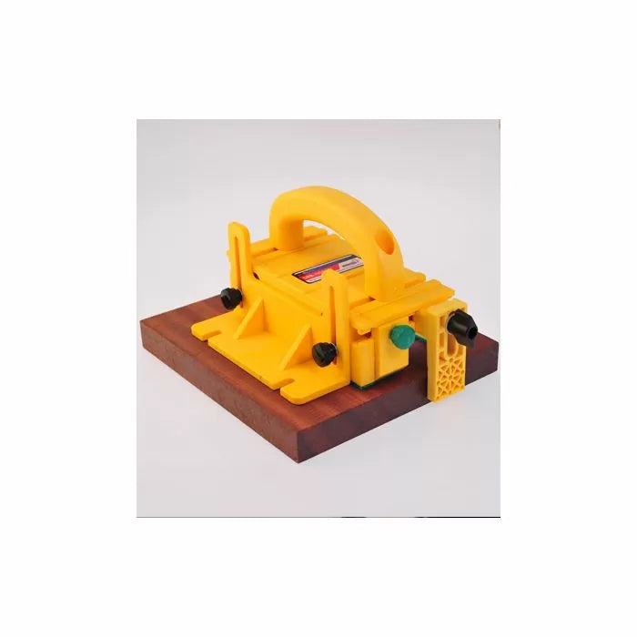 Yellow woodworking push block safety tool on a wooden board for table saws and router tables